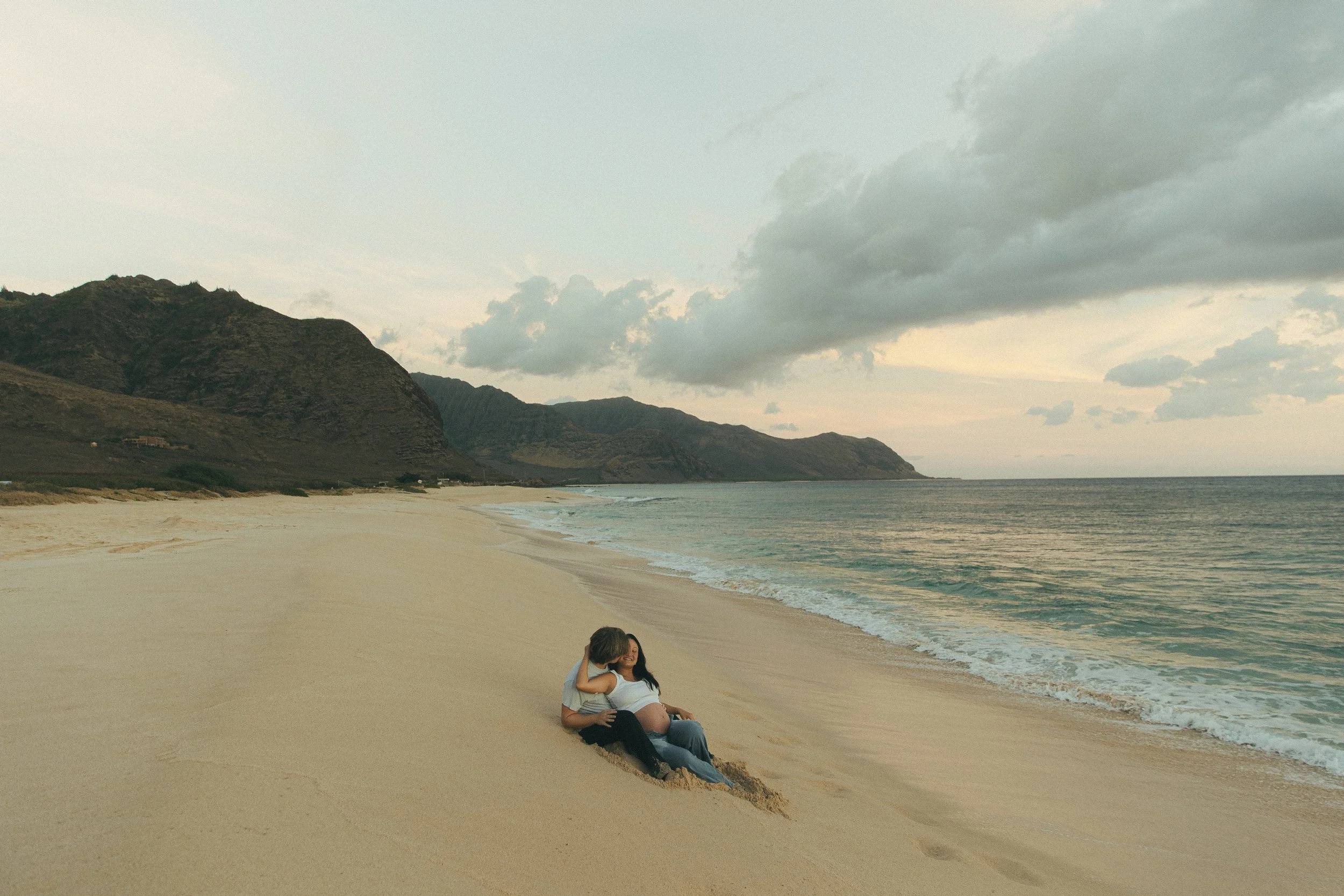 Oahu beach couples portrait with mountains backdrop