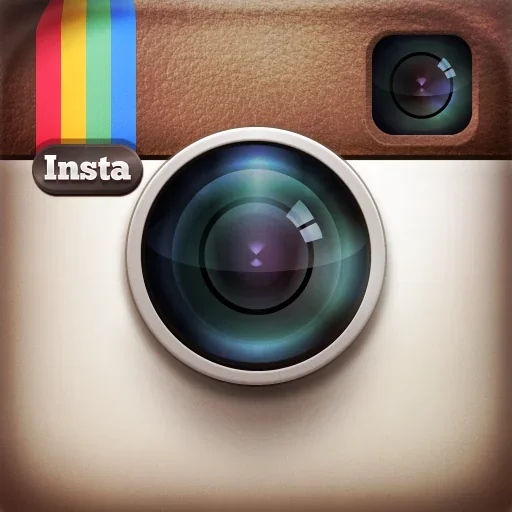 Close-up of an Instagram logo with a camera icon and rainbow stripe.