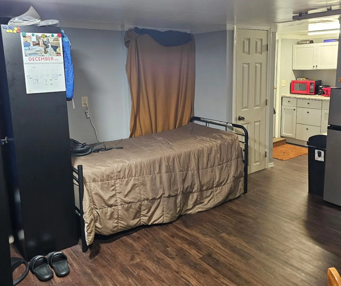 This is part of our down stairs room. there is a partial kitchen down here as well but it is only a sink and microwave.