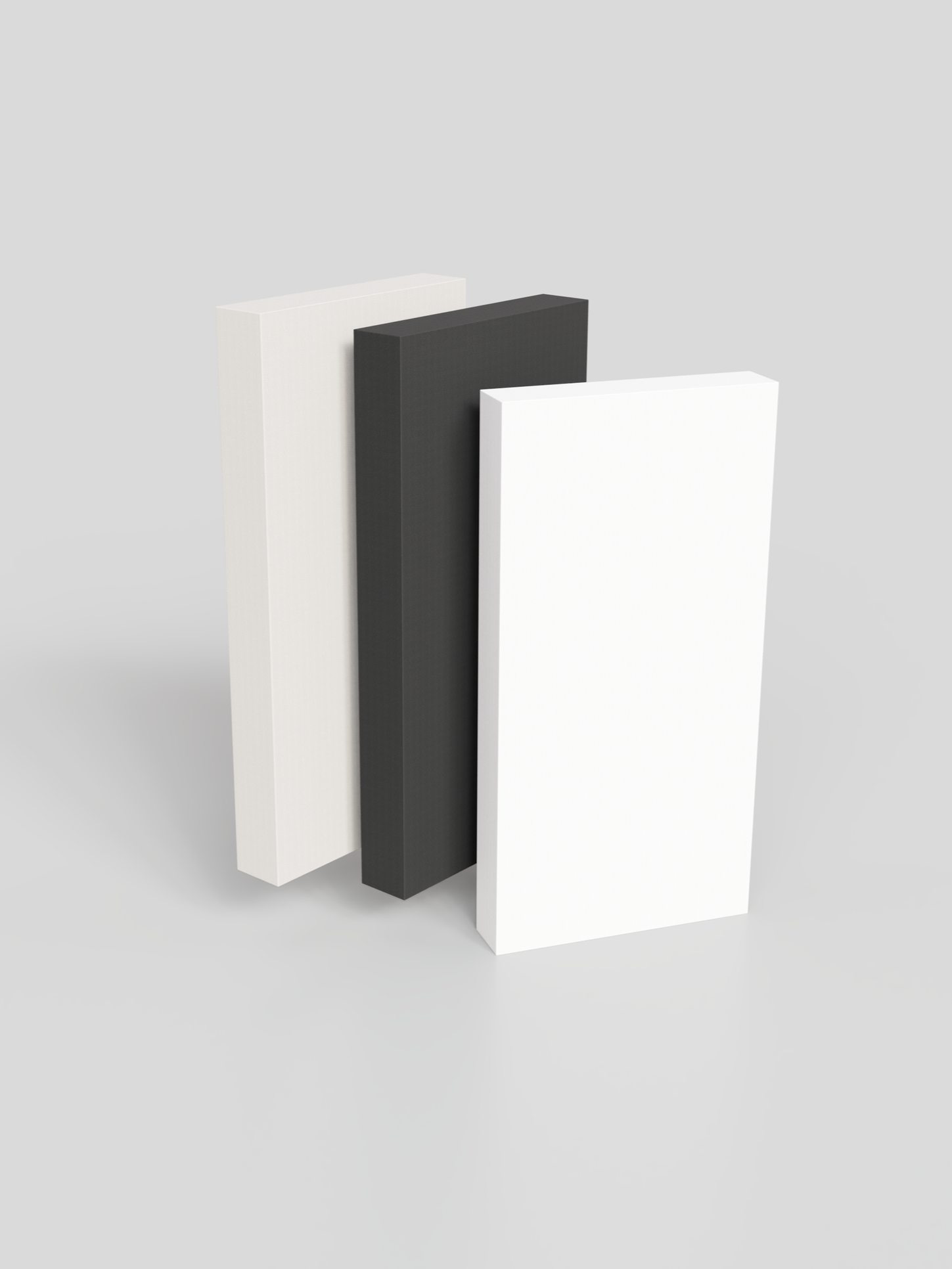 Three rectangular blocks in white, black, and white standing upright, arranged side by side.