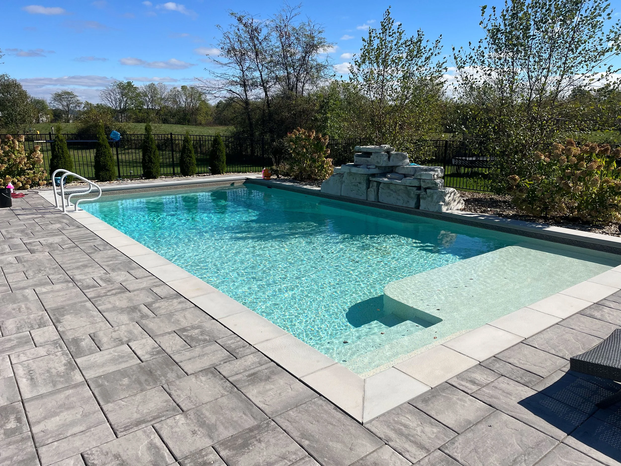 In-ground swimming pool opening and winterization services for residential backyards.