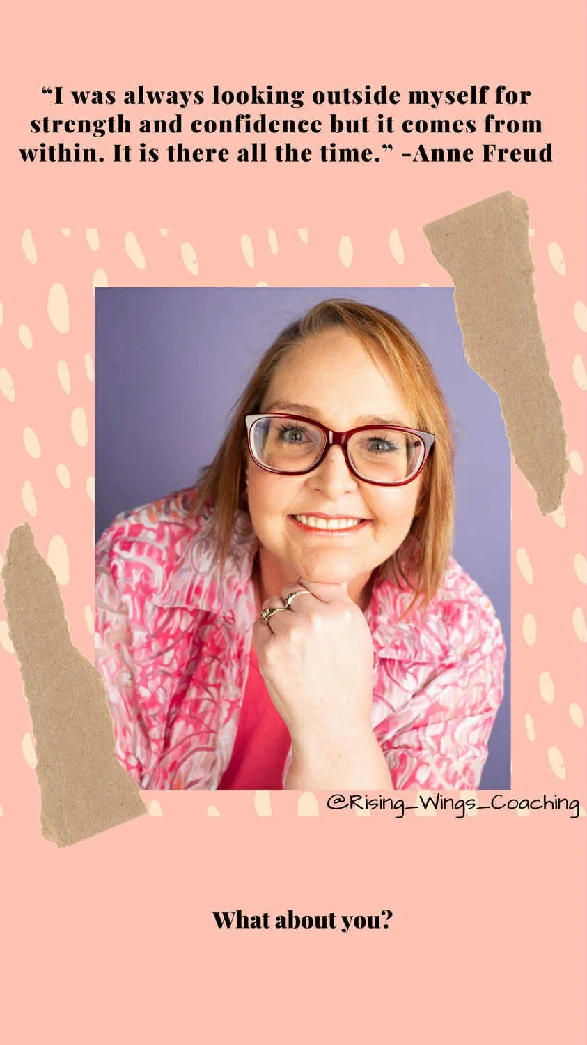 A woman with glasses and shoulder-length reddish hair, wearing a pink patterned jacket, smiling with her hand resting under her chin, against a purple background. The image has a pink background with white dotted and torn paper accents, a quote by Anne Freud, and the text "@Rising_Wings_Coaching" and "What about you?".