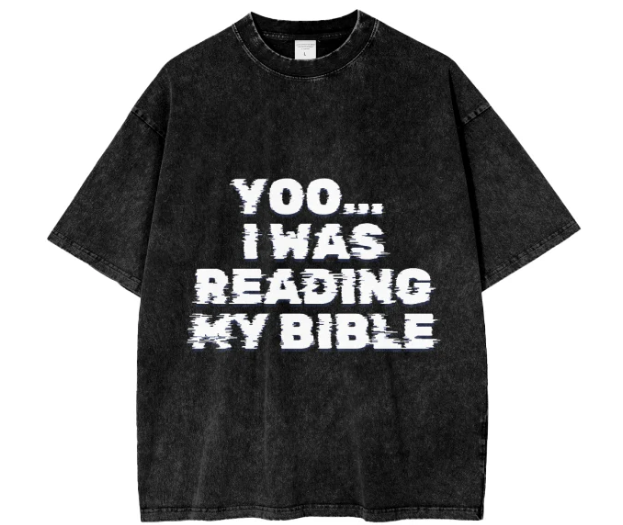 Black T-shirt with white, distressed text that reads "YOO... I WAS READING MY BIBLE."