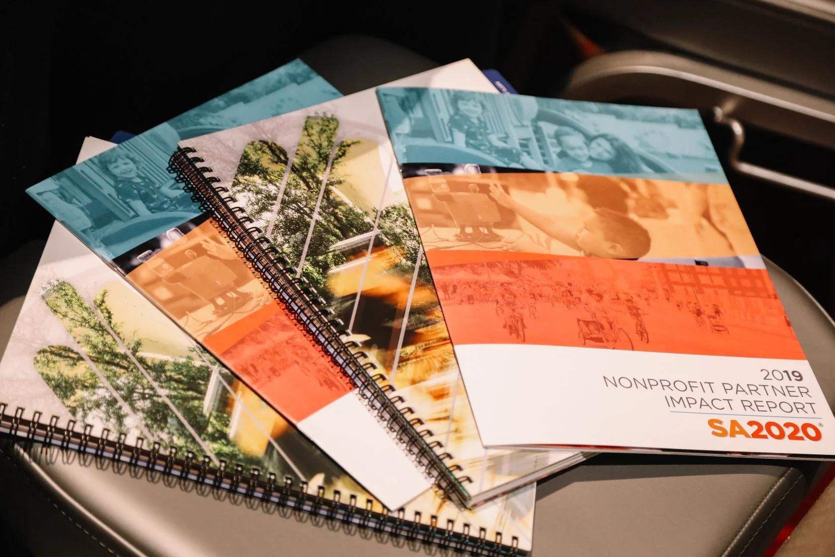 A stack of SA2020 reports on a chair