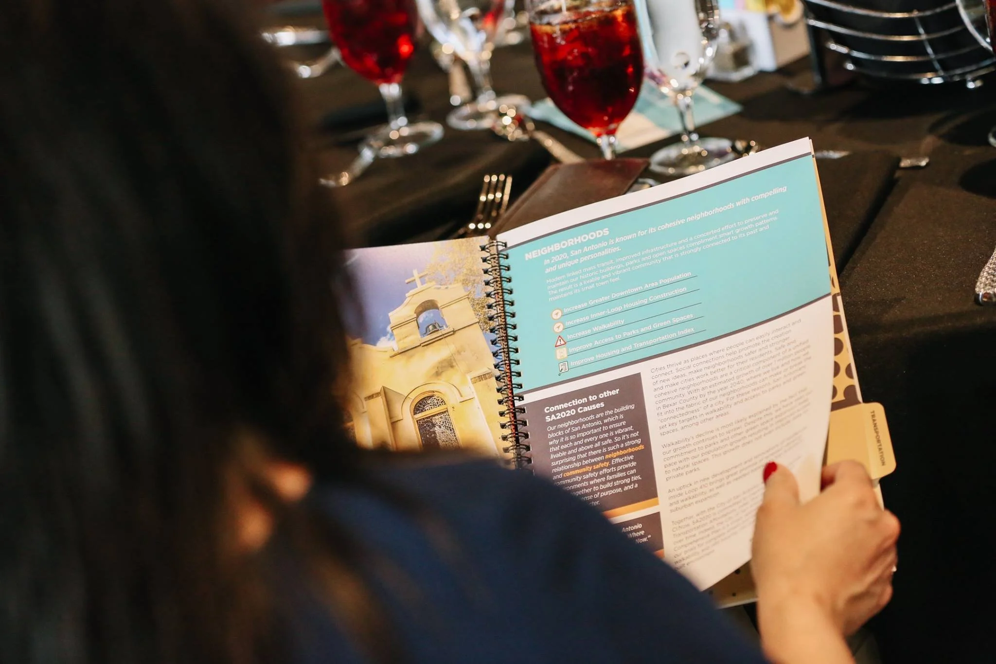 A person reviews the annual SA2020 Report