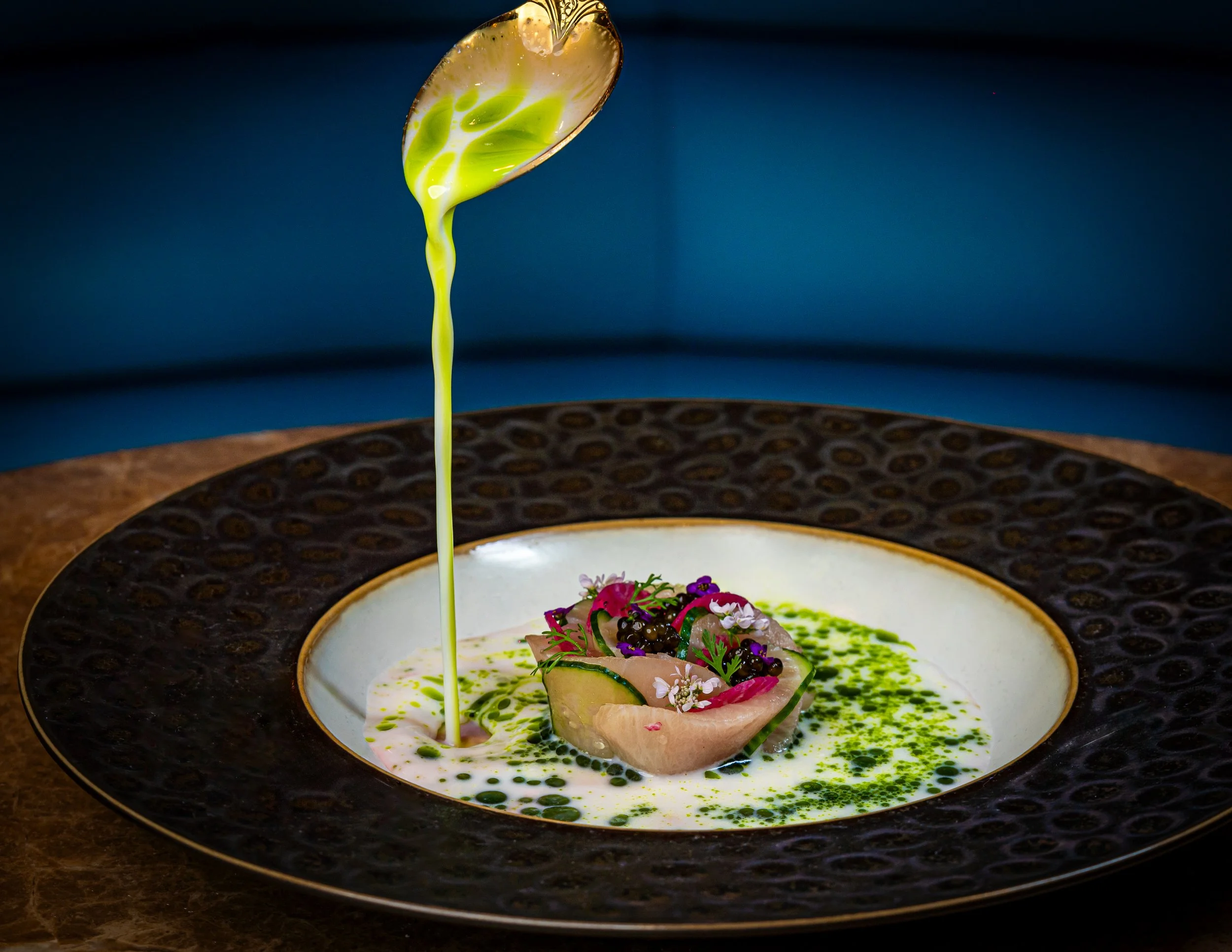 Sauce pouring on High End Meal