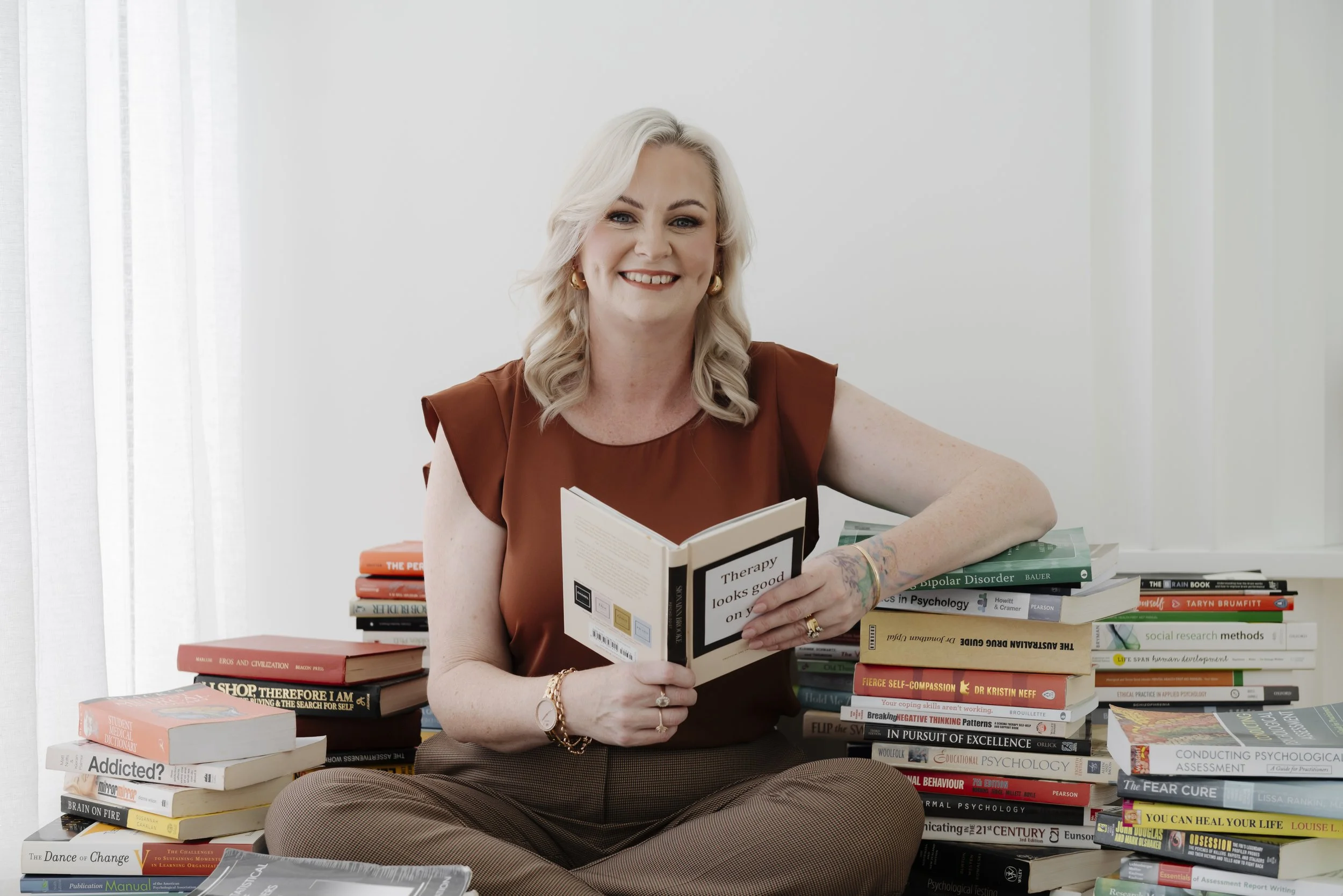 therapist sitting among books