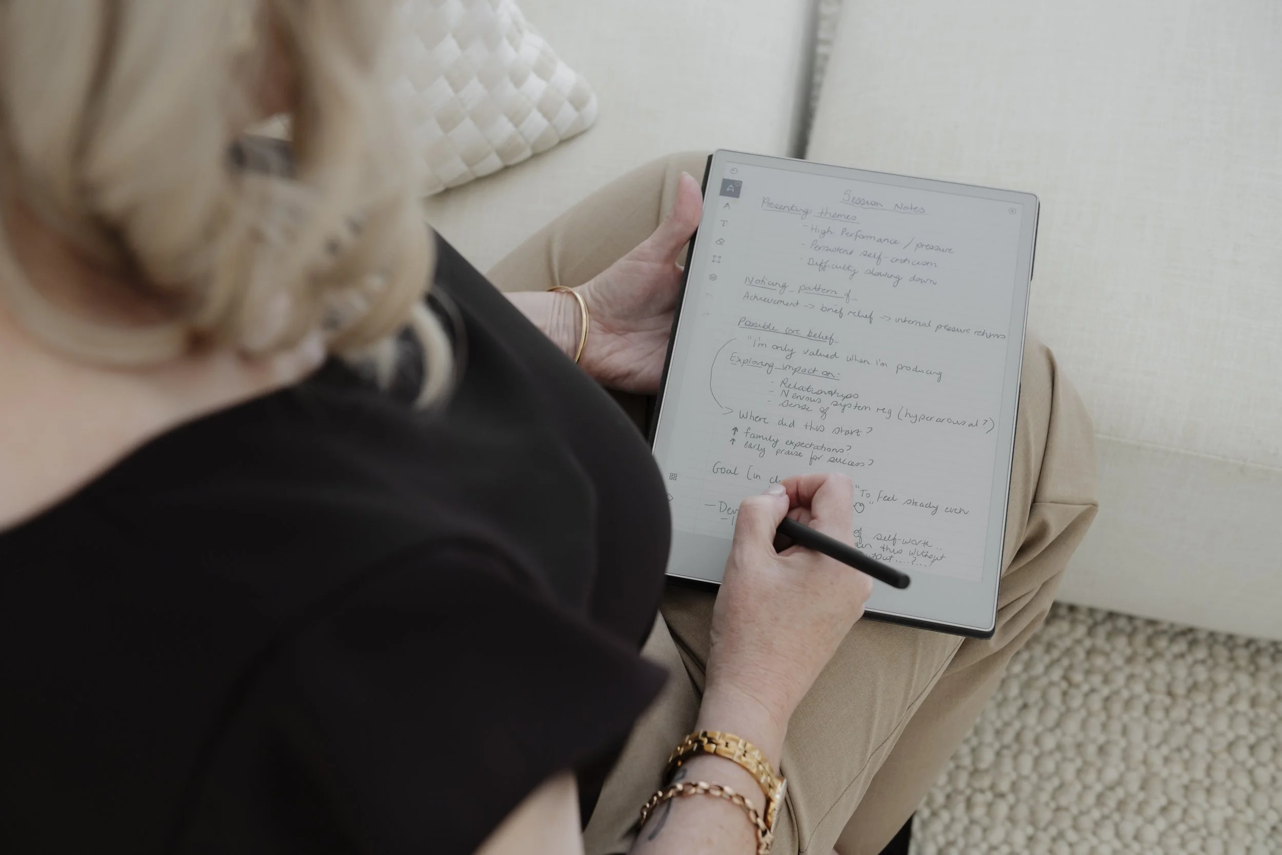 psychologist in session making notes