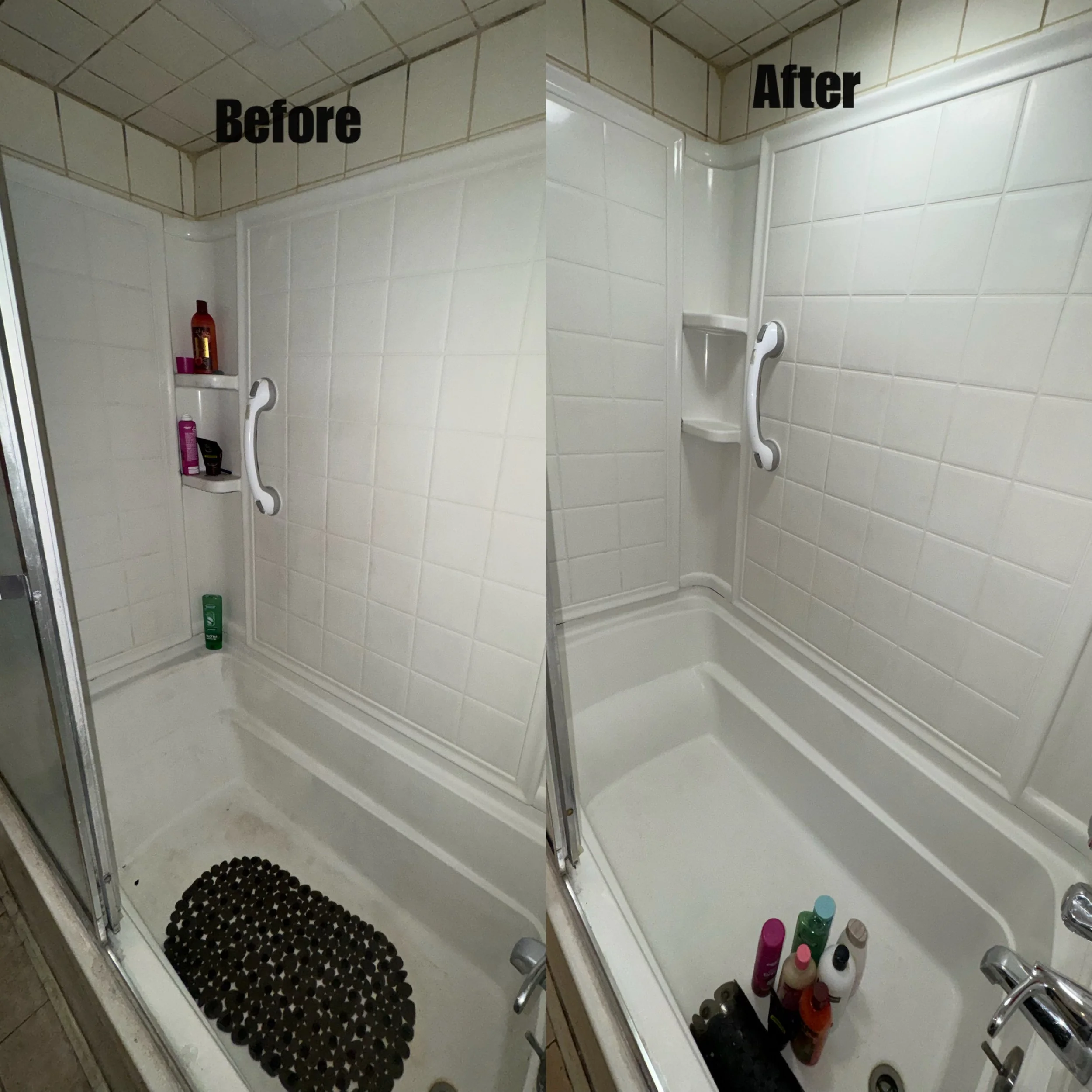 A small shower stall with beige tiled walls and a glass door. Inside, there are various bottles of shampoo, conditioner, and body wash on a built-in shelf. The shower floor has a black, circular textured mat and a few bottles of toiletries are on the