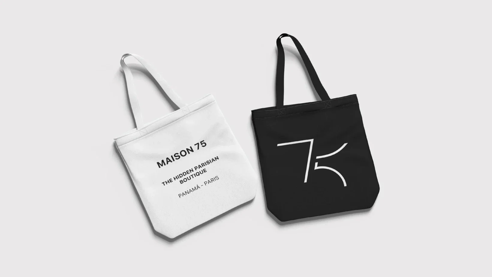Maison 75 branded black and white tote bags, designed by Brandt, a branding agency from Panama City, Panama.