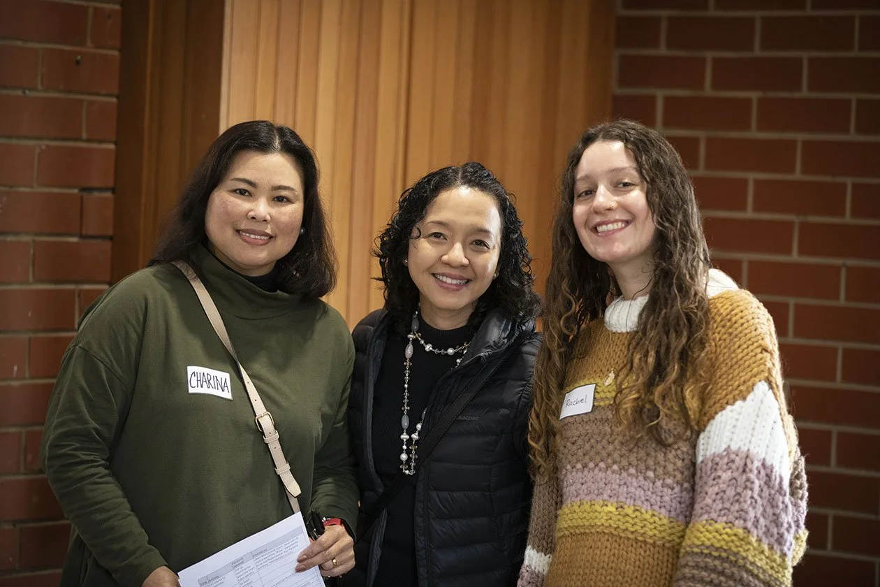 Three ladies standing talking