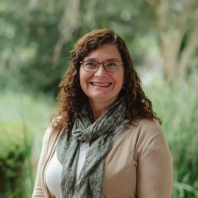 Lady in her fifties wearing glasses