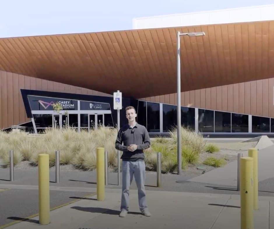 Man standing in the car park off Race Drive, Cranbourne East at Casey Stadium