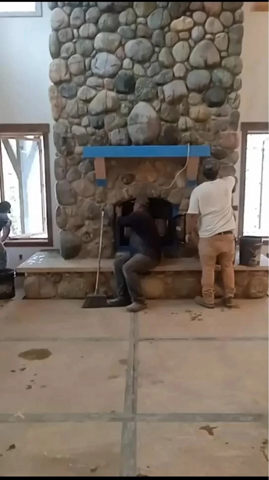 men+working+on+fireplace.jpg