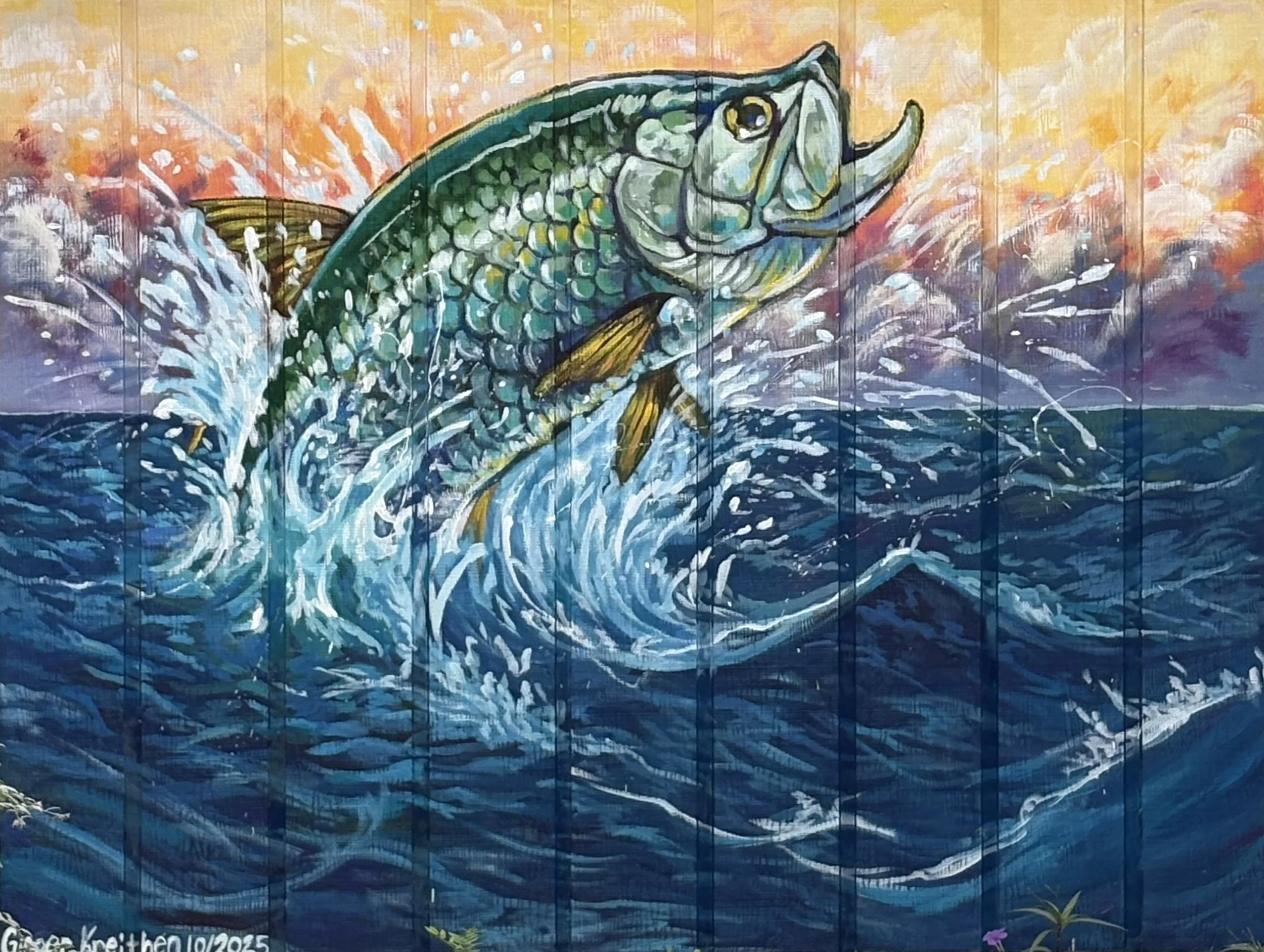 Colorful mural of a large fish leaping out of the water at sunset or sunrise, with splashes and waves around it.