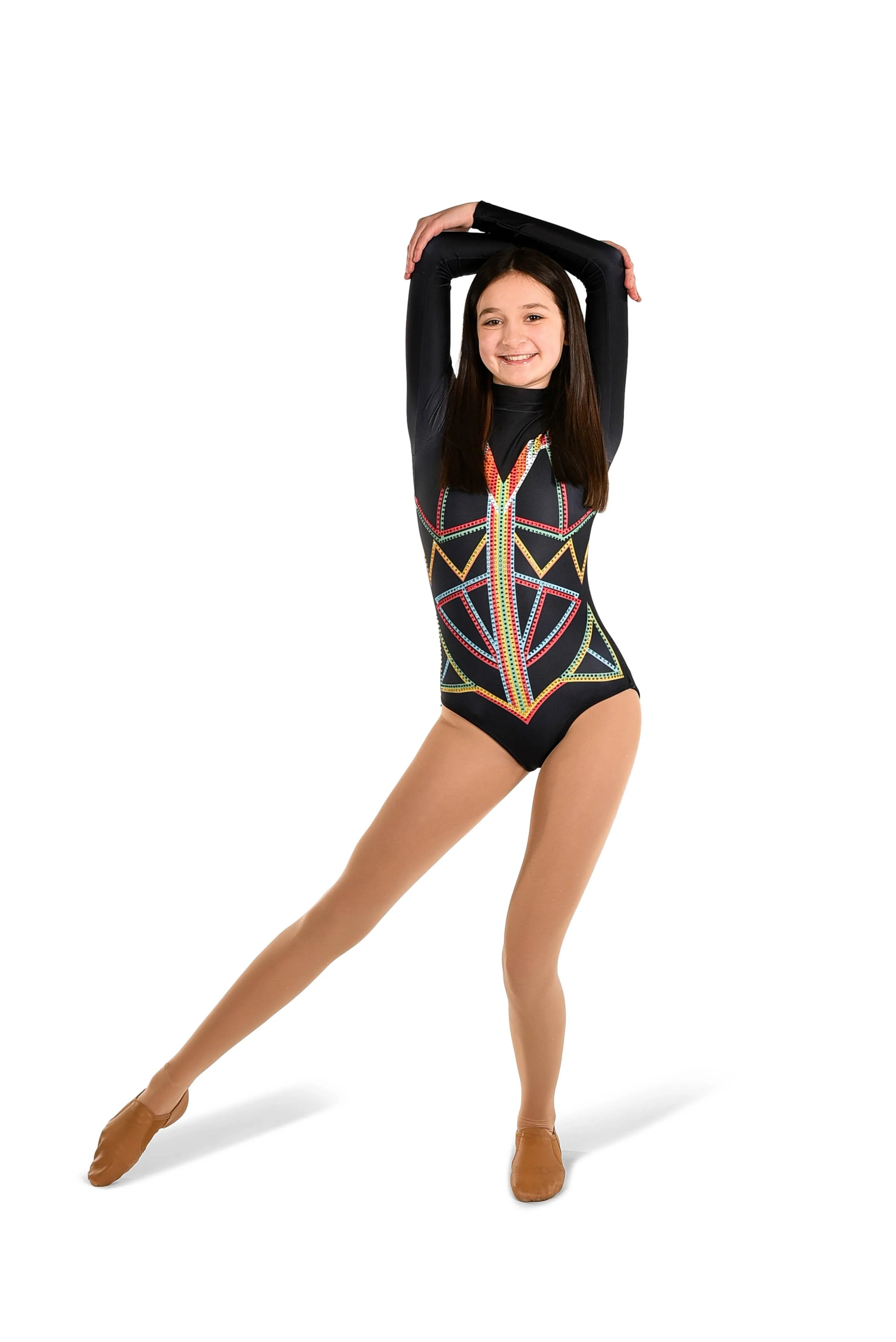 Young girl wearing a colorful leotard with geometric designs, posing with arms raised above head, smiling, and wearing tan dance shoes.
