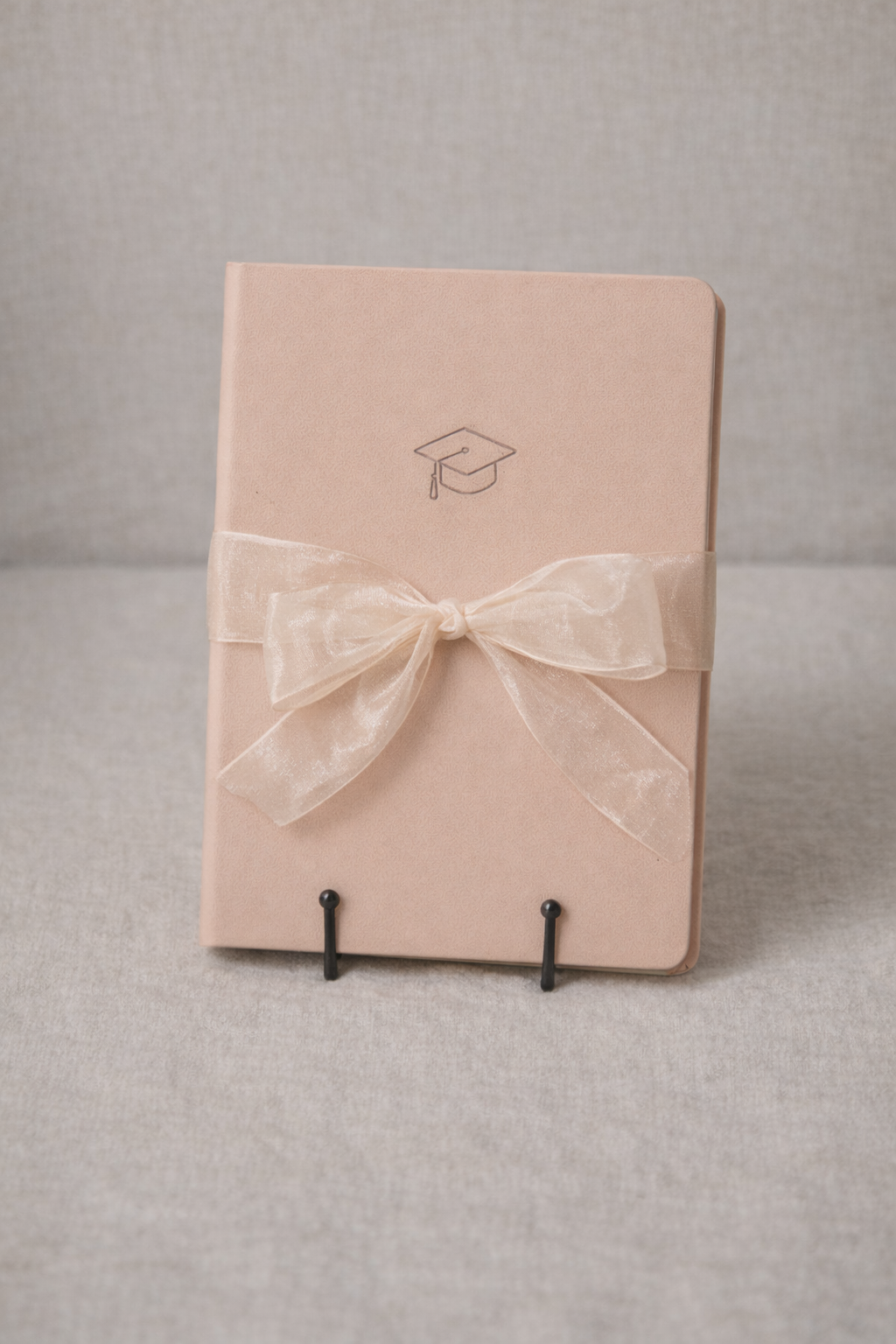 Graduation journal with ribbon bow.png