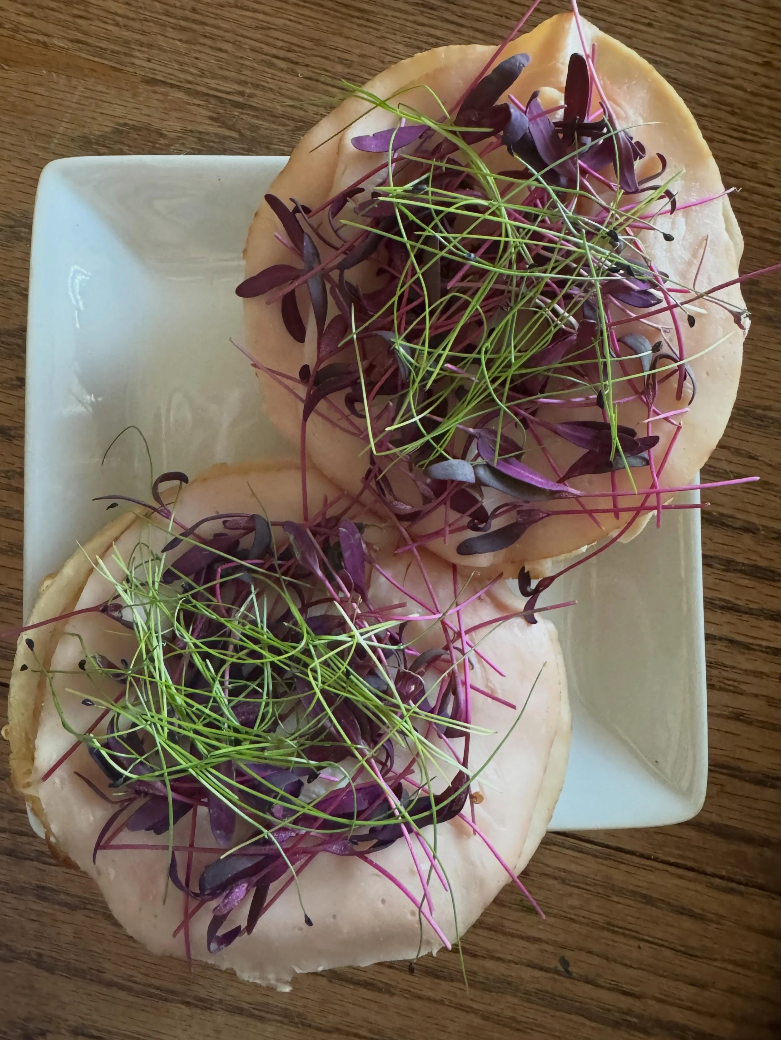 Lunch today: lightly toasted @mermaidkitchenmadison cheese bagel topped with Laughing Cow light cheese, lunch meat, and some of our Red Orach and Chives micros. Yum!