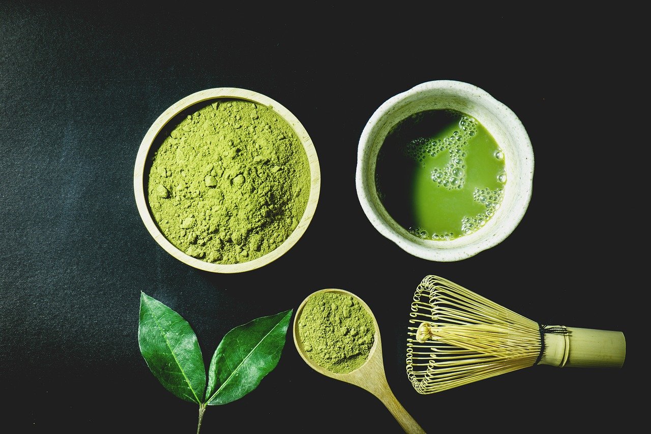 Traditional matcha preparation with ceremonial grade Japanese matcha powder, whisk and bowl.