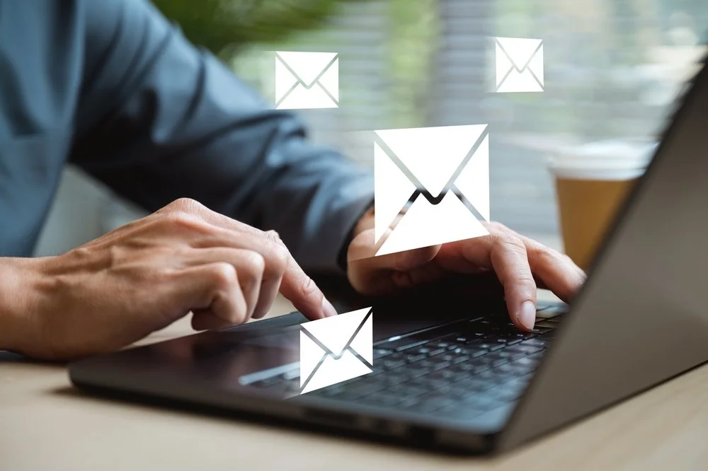 Small business owner working with an IT provider on a business email migration service to move email accounts to Microsoft 365