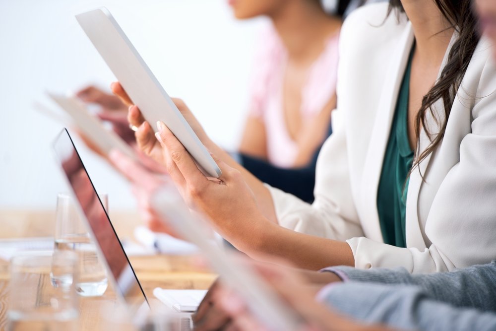 Employee using a personal smartphone to access business email highlighting byod security solutions needed for small business data protection