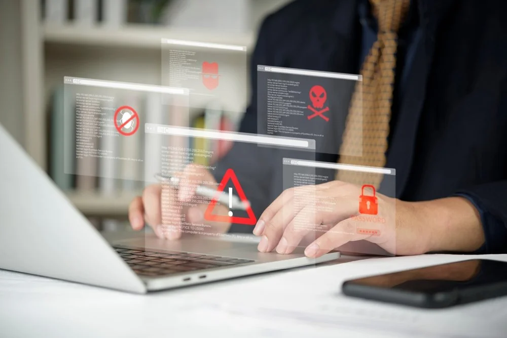 Gennix IT security specialist conducting a cyber threat prevention assessment on a business network in a Lower Mainland office