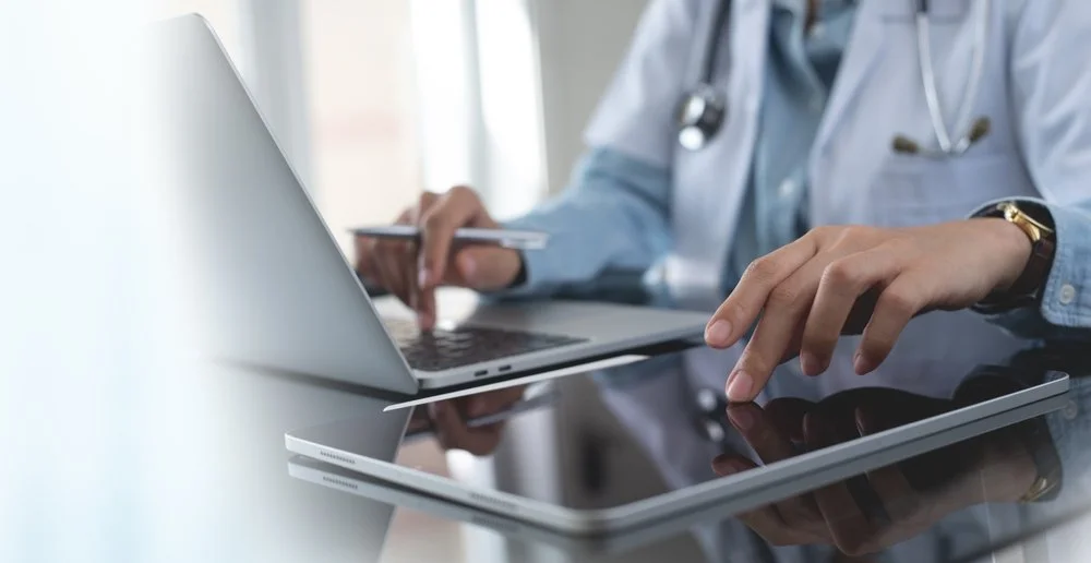 Medical clinic reception desk showing secure network setup after transitioning from the private physician network to commercial internet