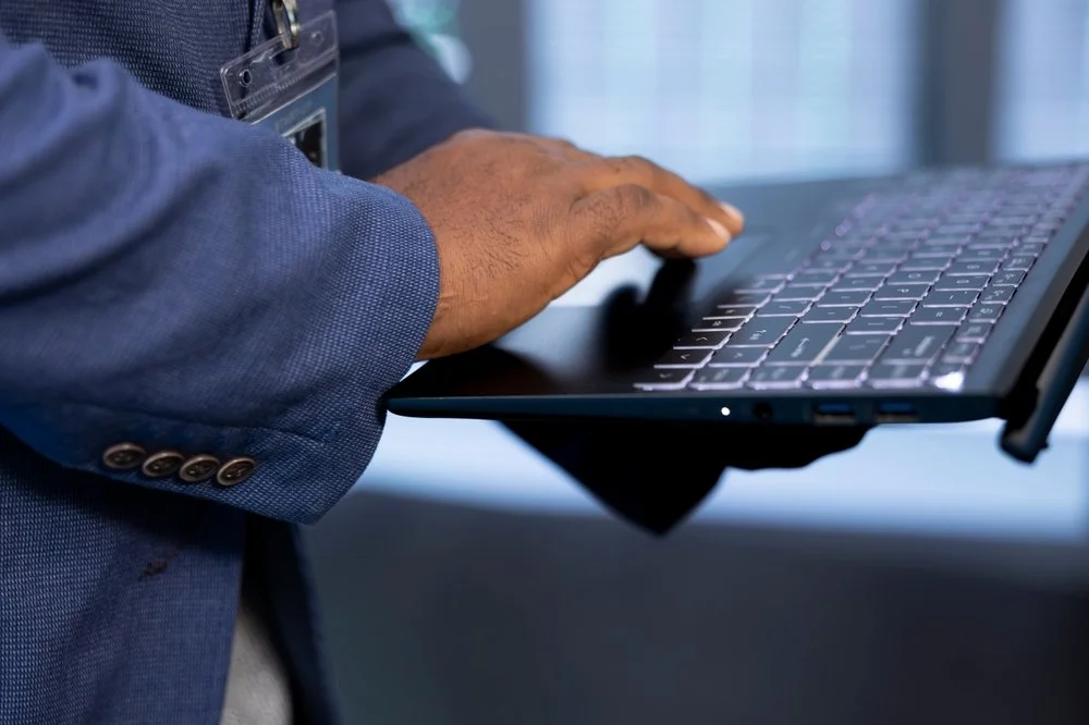 Business owner in Surrey reviewing data migration problems with the Gennix managed IT services team in BC.