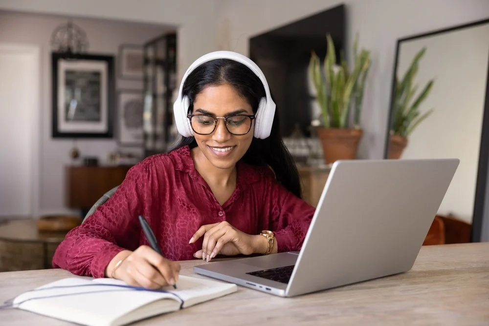 Business owner reviewing cyber threat prevention controls and cybersecurity risk management report with a Gennix consultant
