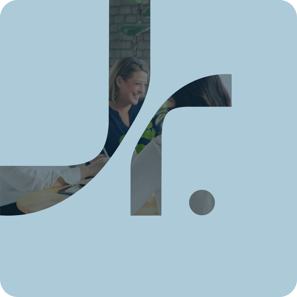 A logo with a light blue background and a stylized lowercase letter 'f' cut out from the center, revealing a partially visible woman smiling and talking in a casual office setting.