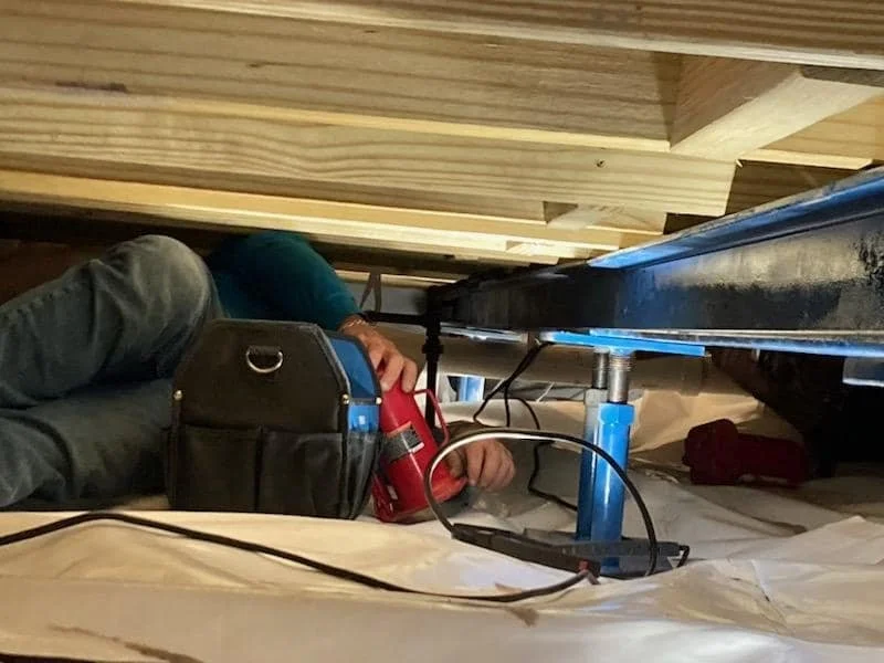 An AllPro Crawlspace employee adding structural support to a residential home in Wilmington, NC.