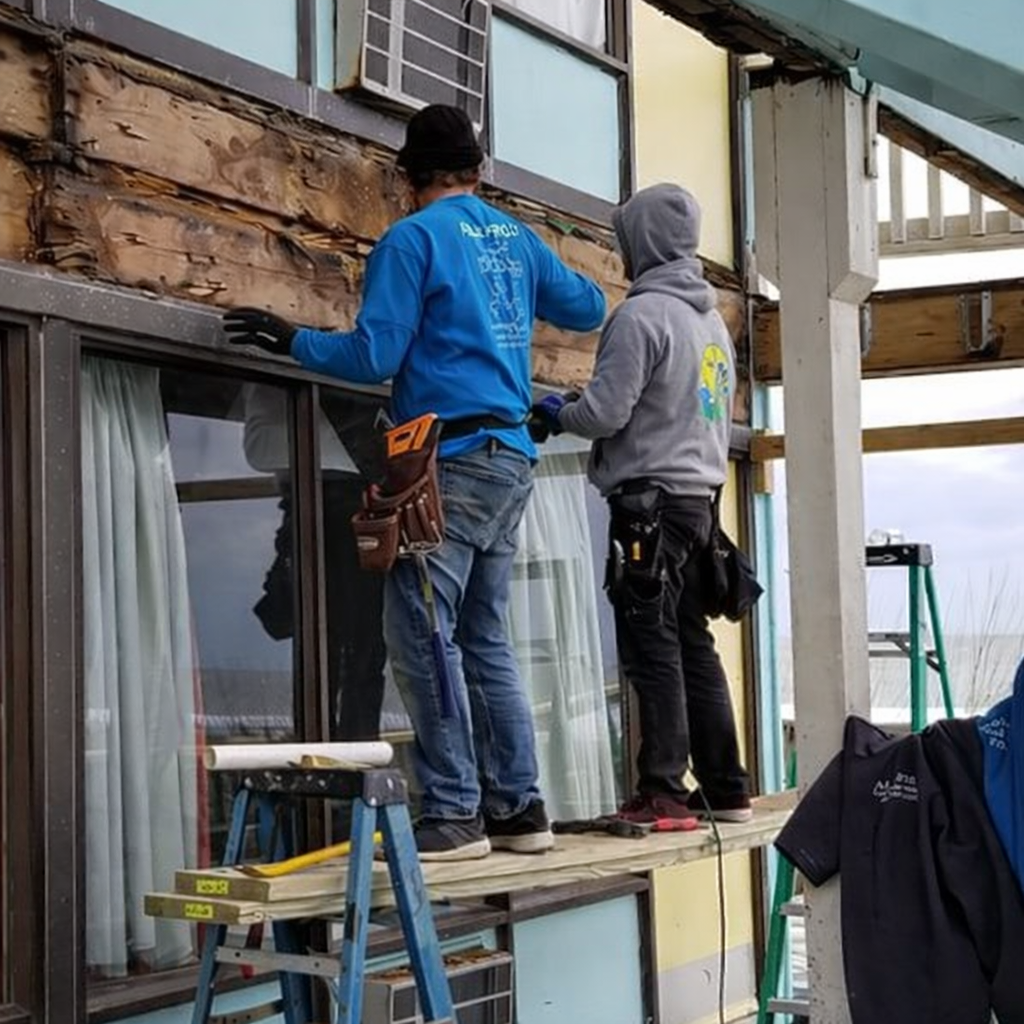 Two AllPro Crawlspace employees on a jobsite.