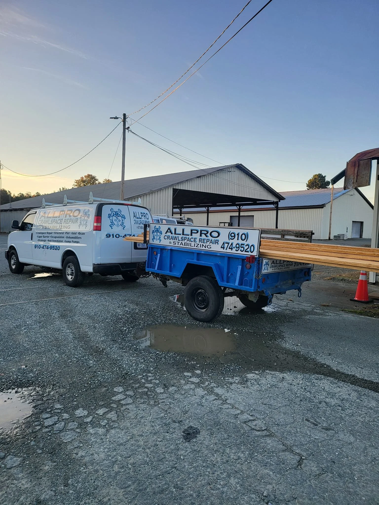 A picture of an AllPro Crawlspace van and trailer.