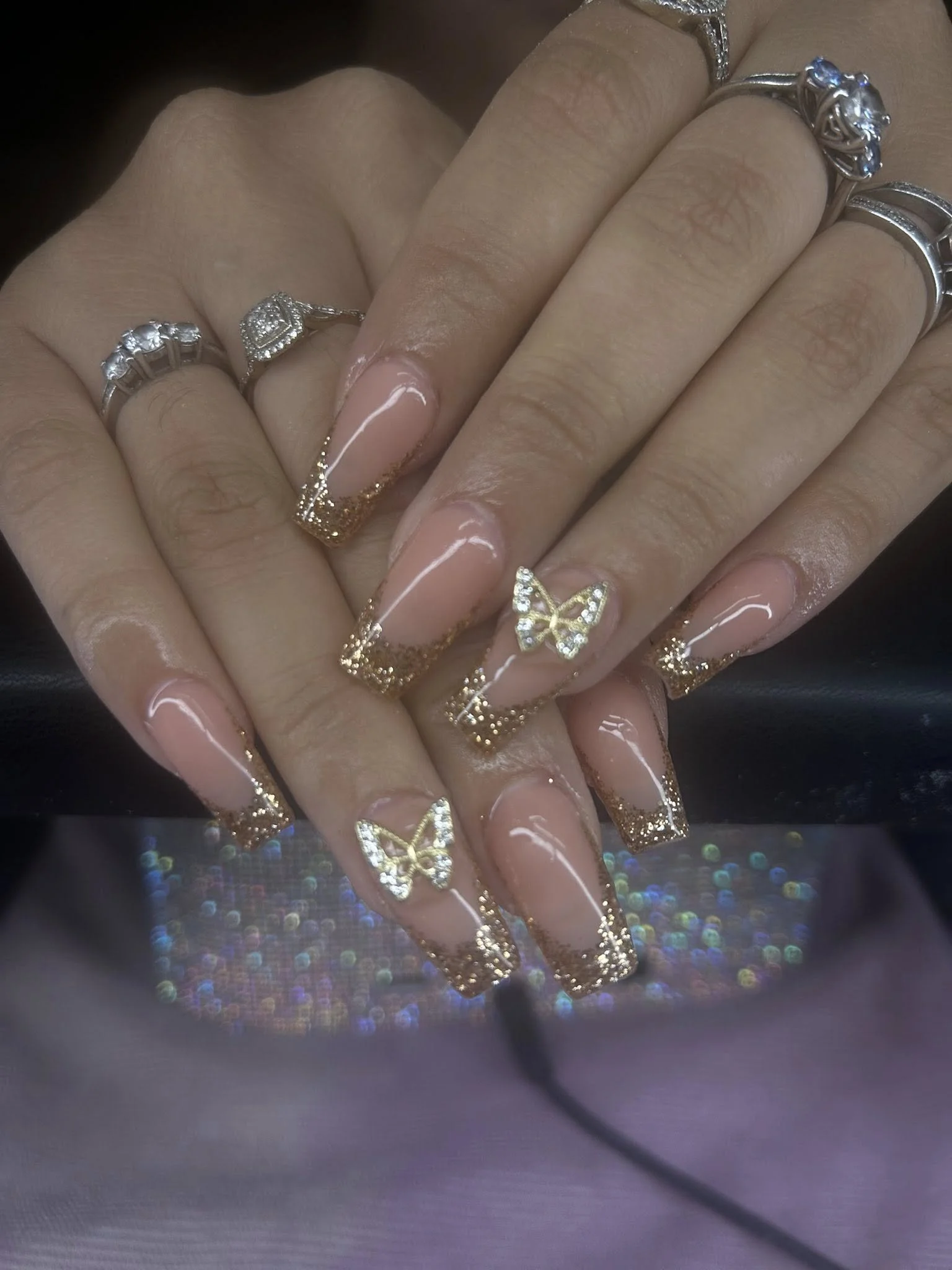 Glam nail art with gems, glitter by Ellie Denzer