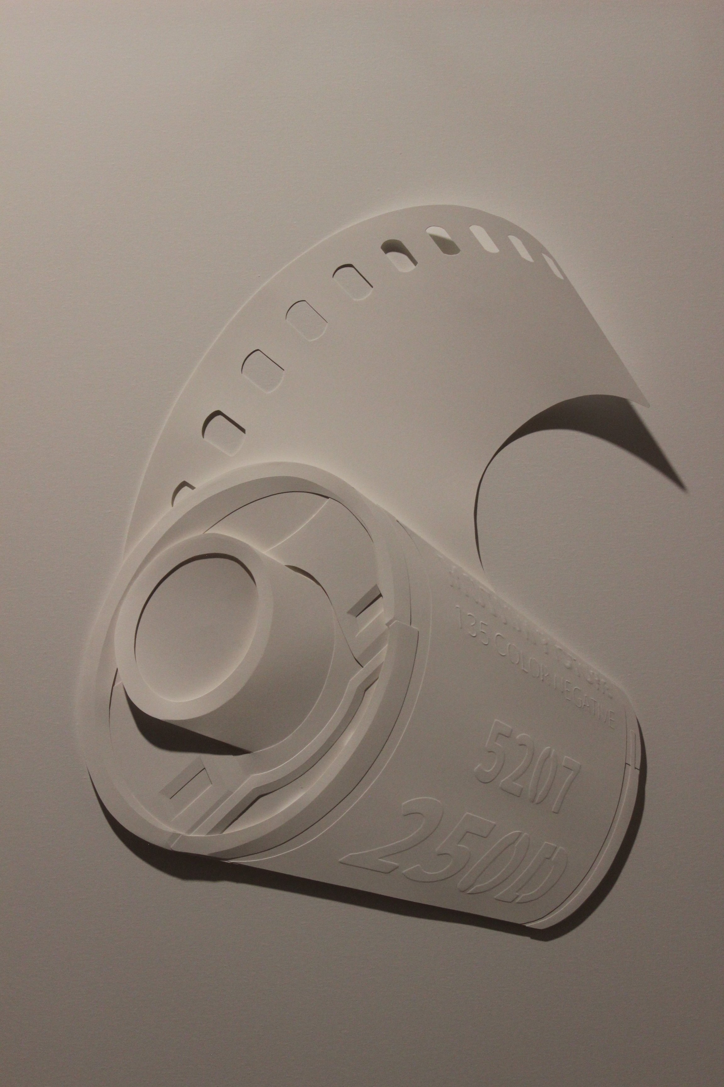Paper sculpture of 35mm roll of film. Fuji Film