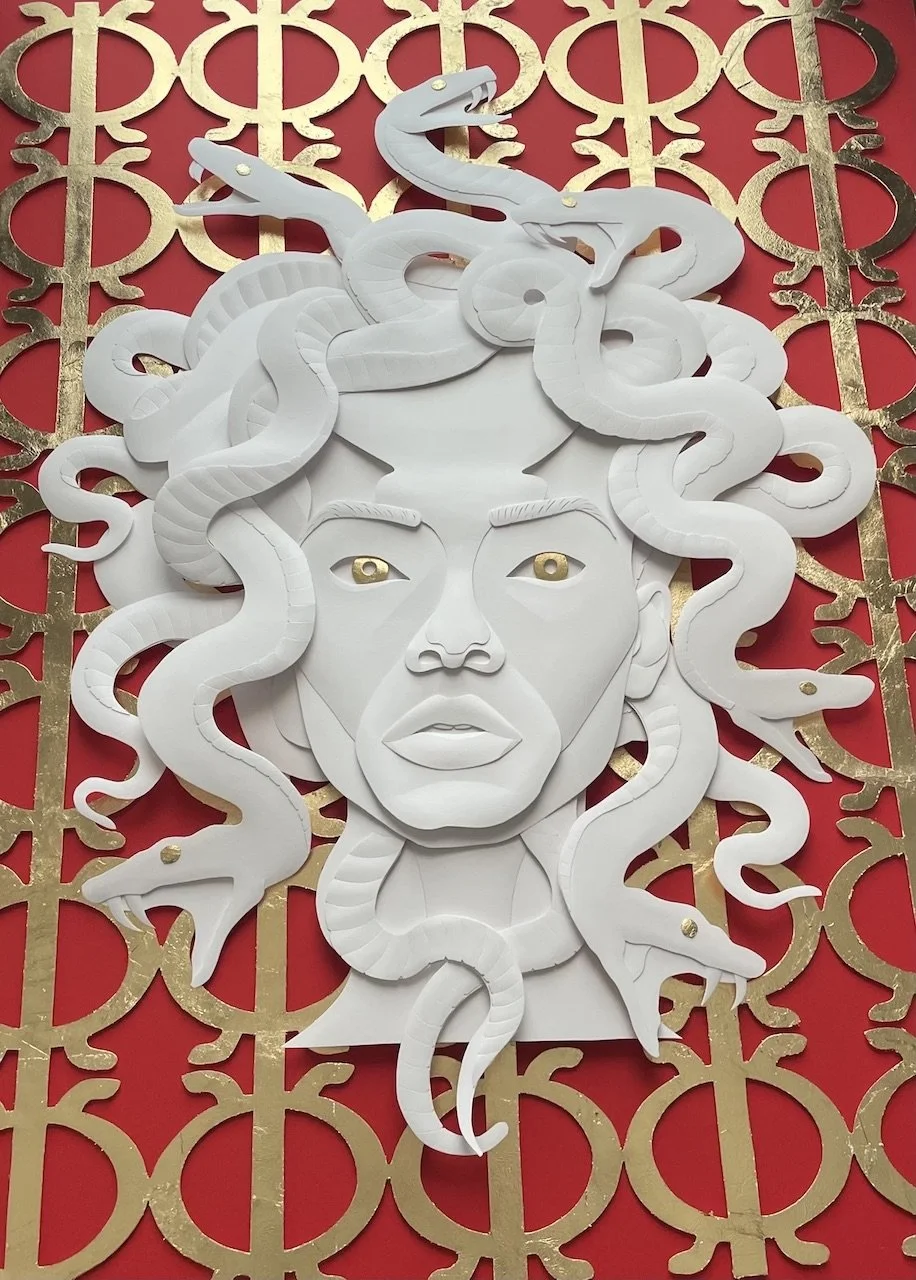 Paper sculpture of Medusa. The background shows repeating pattern of the Adinkra symbol for resilience.