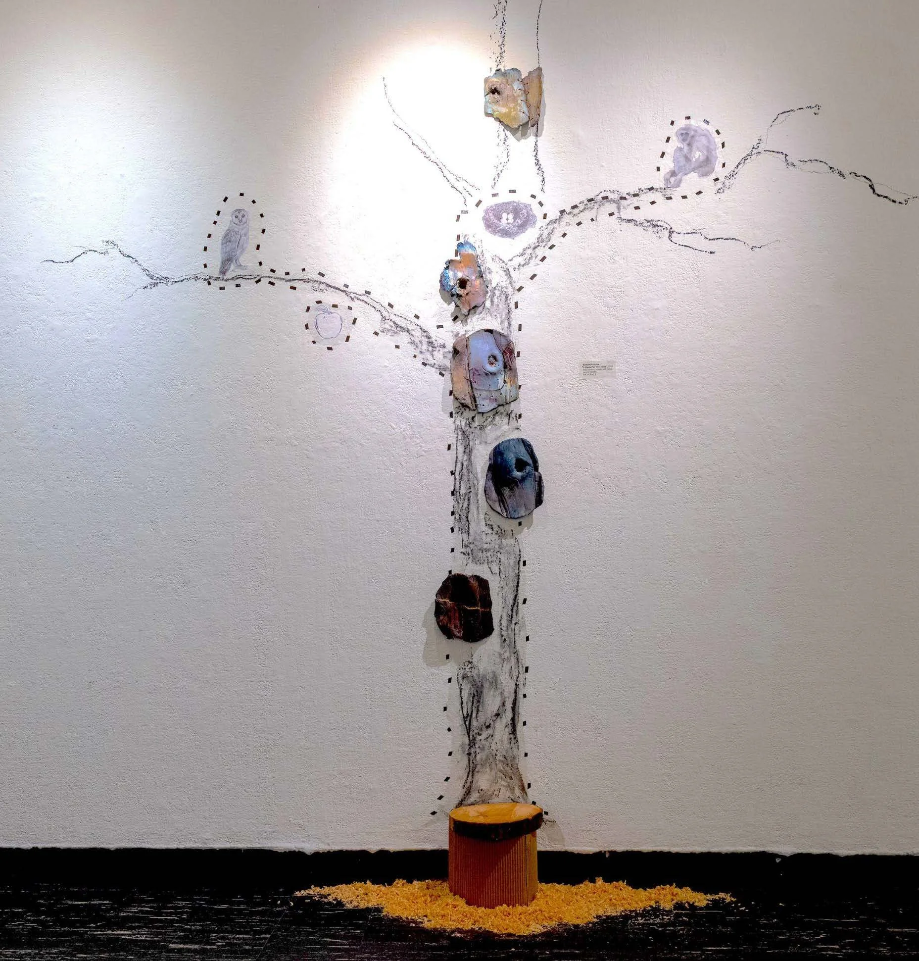 "Echo of the Felled Tree" | 2025 | Installation (charcoal, raku ceramic, wood stump, wood shaving) | 72” x 45” x 10“