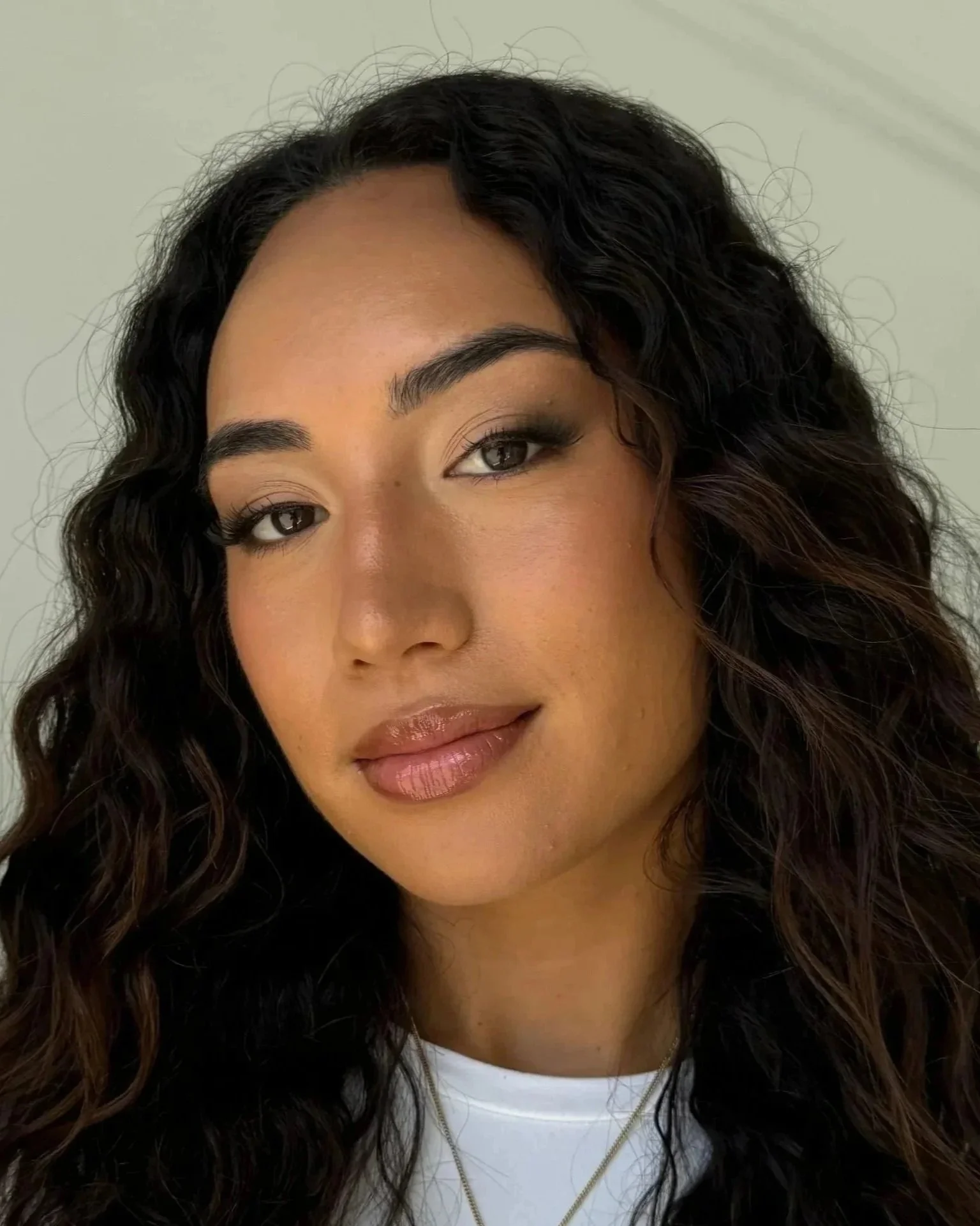 Soft glam bridal makeup look with natural skin and neutral tones