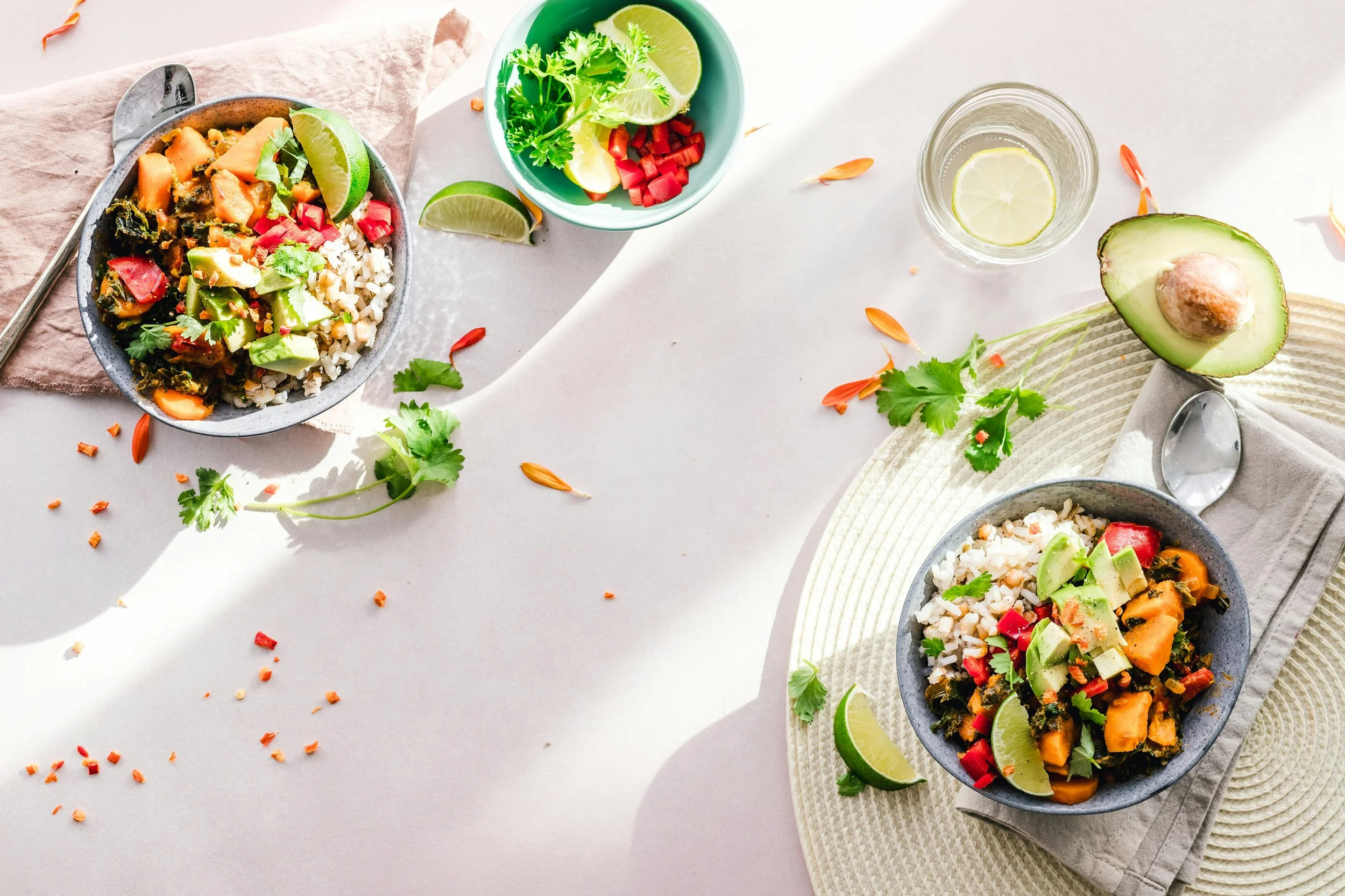 Bowls of fresh vegetables, fruit and healthy foods that support a balanced diet