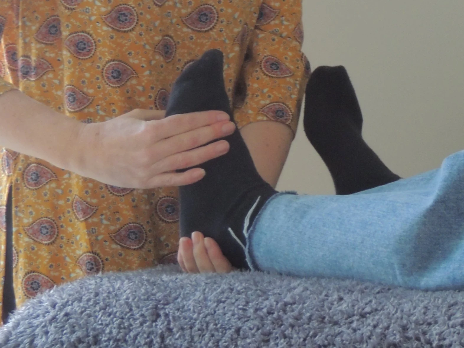 Close up of foot muscle testing during a kinesiology session
