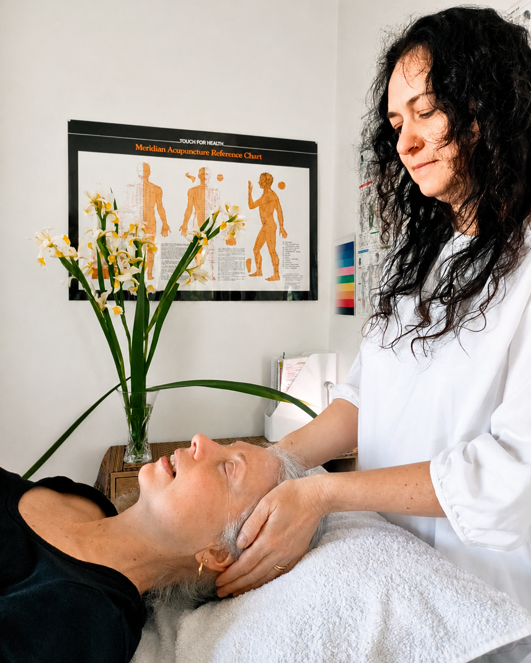 Practitioner performing relaxing RESET TMJ session