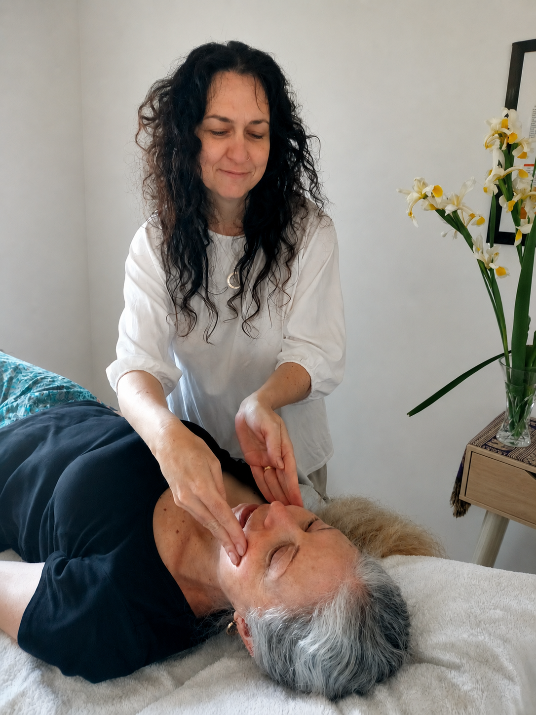 Practitioner performing gentle RESET TMJ