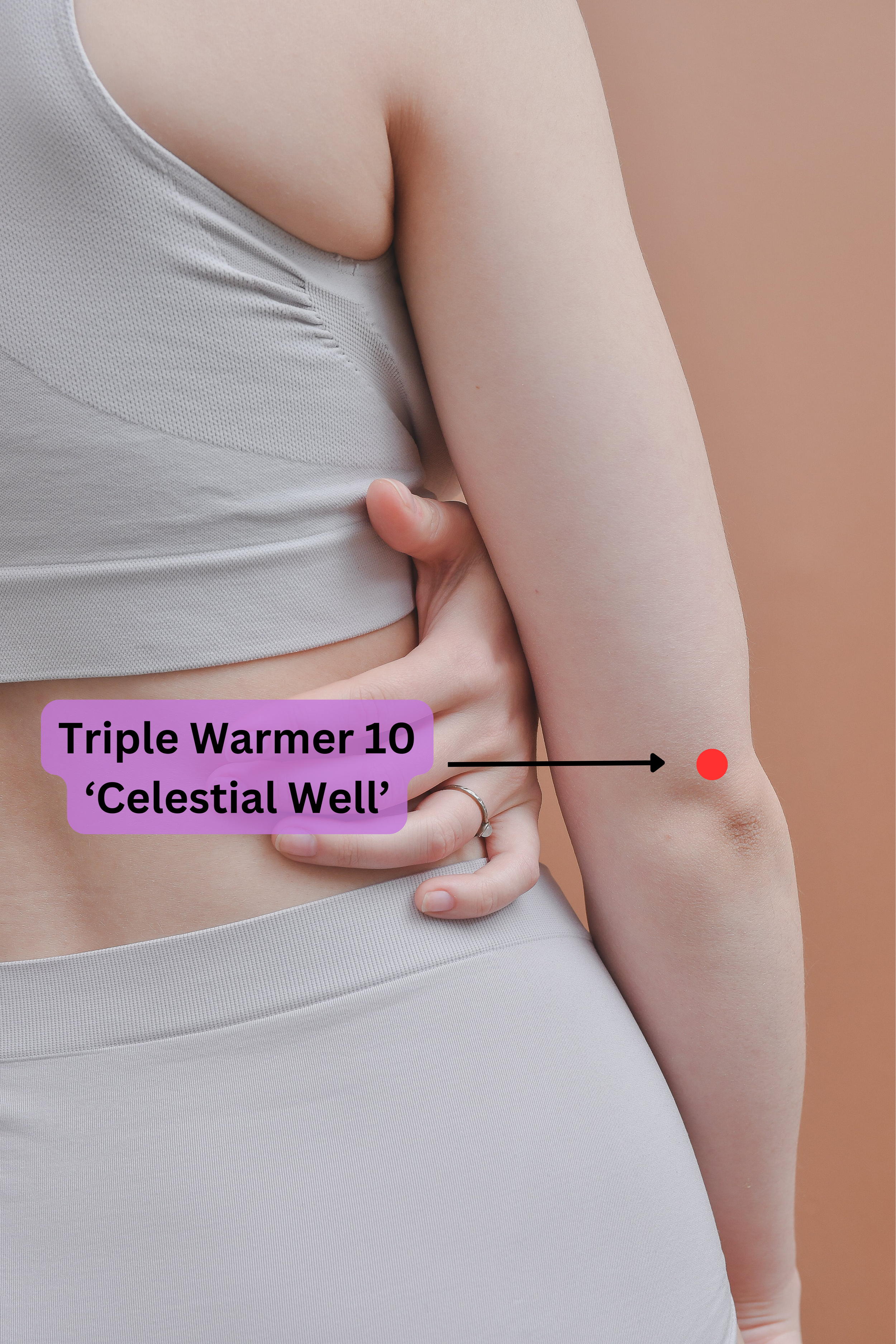 Back of a woman's arm showing the location of the Triple Warmer 10 (Celestial well) acupressure point