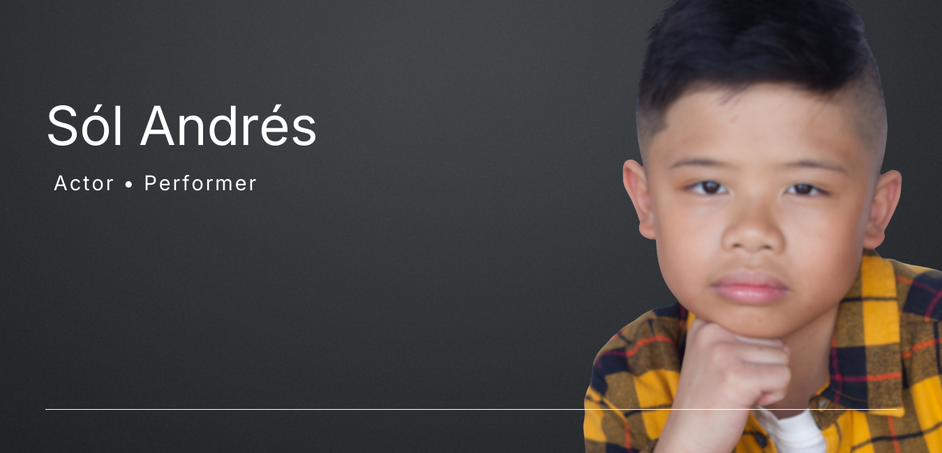 Banner Headshot Photo of child actor posing and facing forward with hand underneath chin on right side of banner wearing a yellow collared flannel shirt.   On left hand side of photo in large white font reads "Sól Andrés."