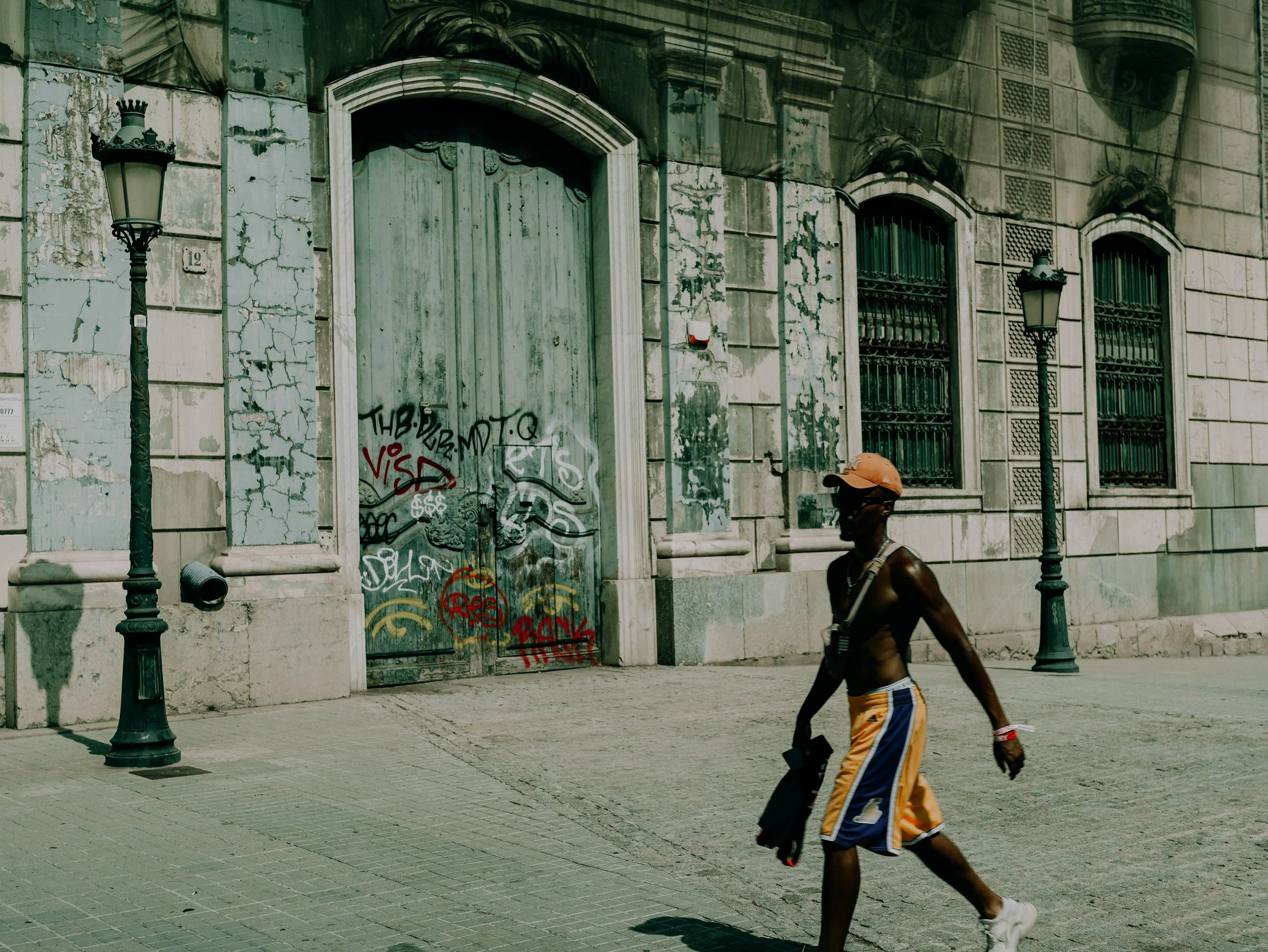 240824_Barcelona_Man Walking in Lakers.jpg