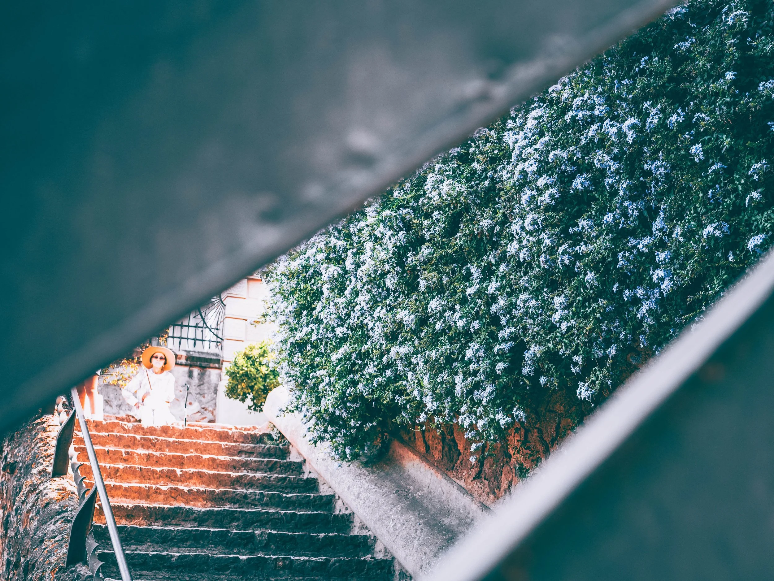 240826_Barcelona_park guell lady through fence.jpg