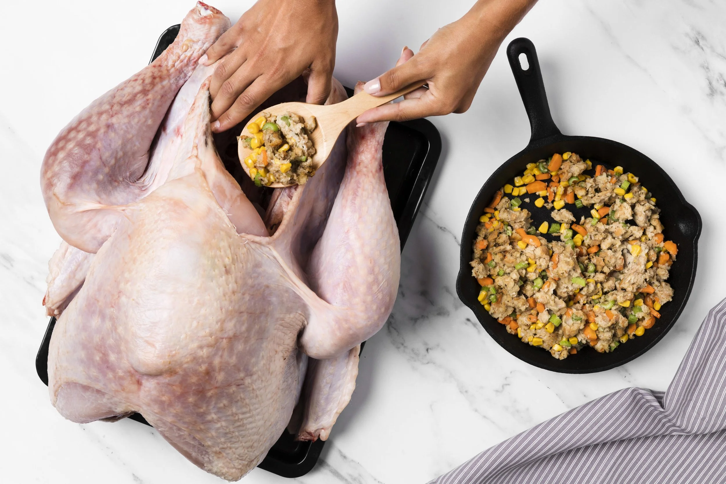 close-up-hands-stuffing-turkey.jpg