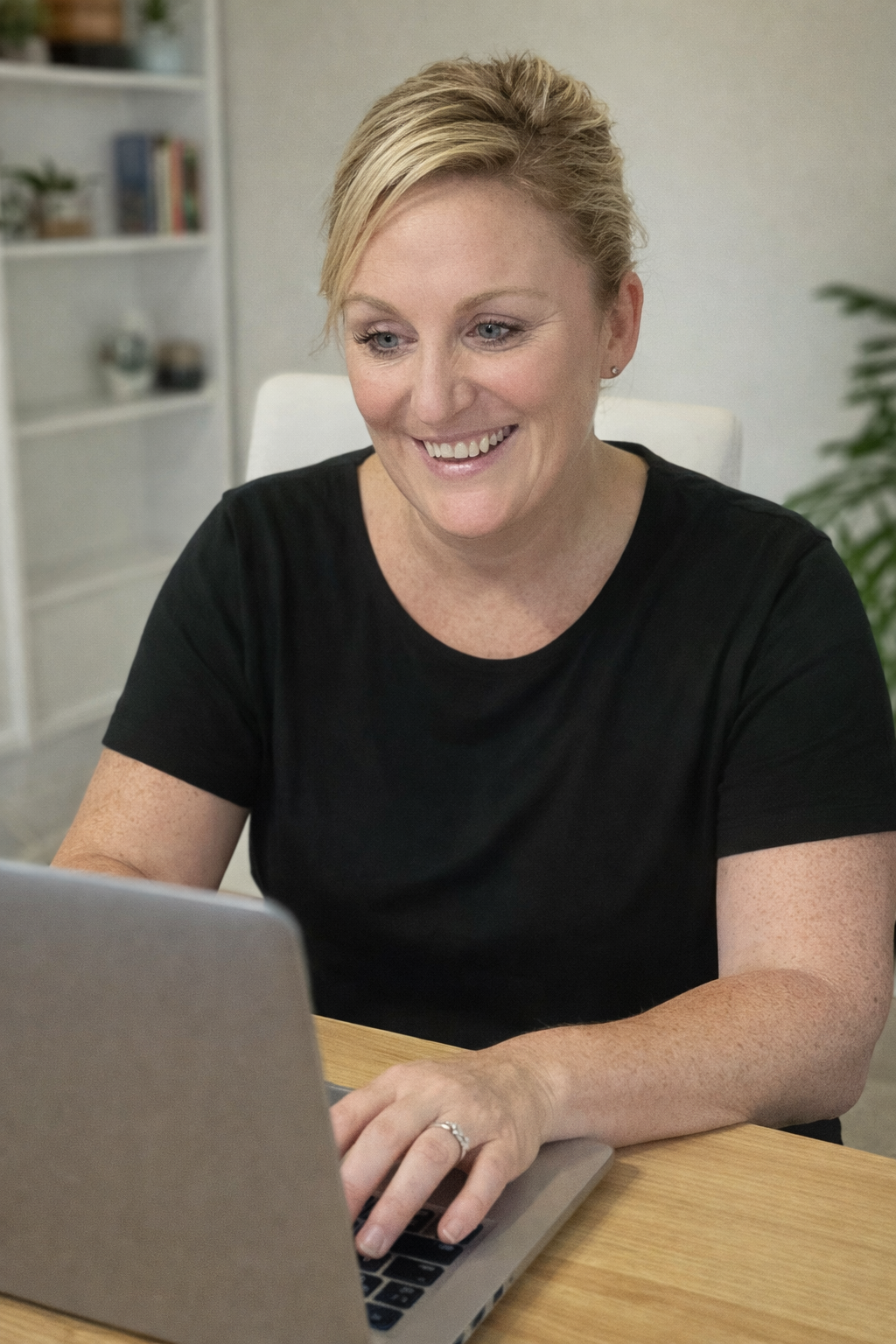 Jill Webb Founder of Online Squad sitting at desk