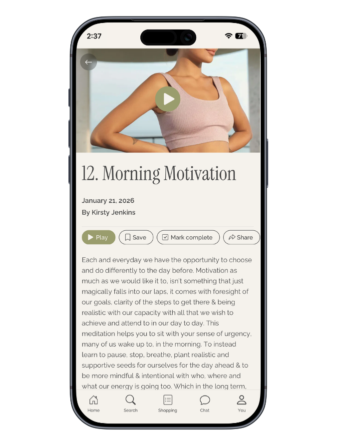 A smartphone screen displaying an article titled '12. Morning Motivation' by Kirsty Jenkins, dated January 21, 2026. The top of the screen shows the time 2:37 and a full battery icon. The article includes a video thumbnail of a woman in workout attire with a play button overlay. Below the article, there are options to play, save, mark complete, and share. The bottom navigation bar includes icons for home, search, shopping, chat, and user profile.