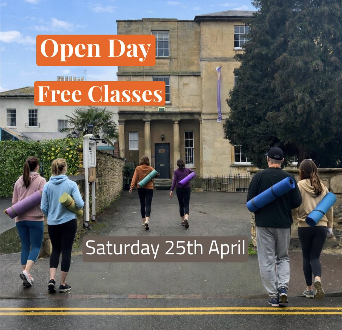 A group of six people, four women and two men, walking towards an old building while carrying exercise mats on their shoulders. The building is a historic stone house with large windows, surrounded by greenery. Text overlays say "Open Day", "Free Classes", and "Saturday 25th April".